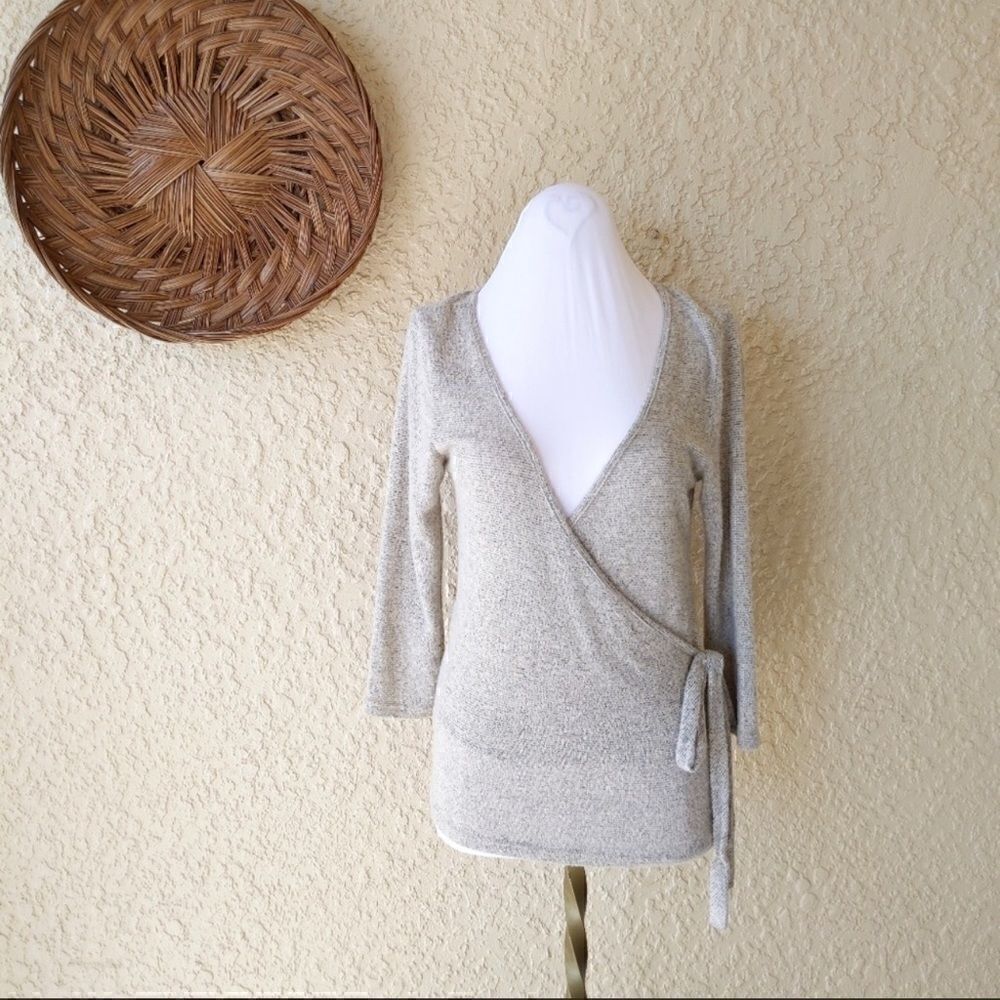 Caution to the wind faux wrap sweater